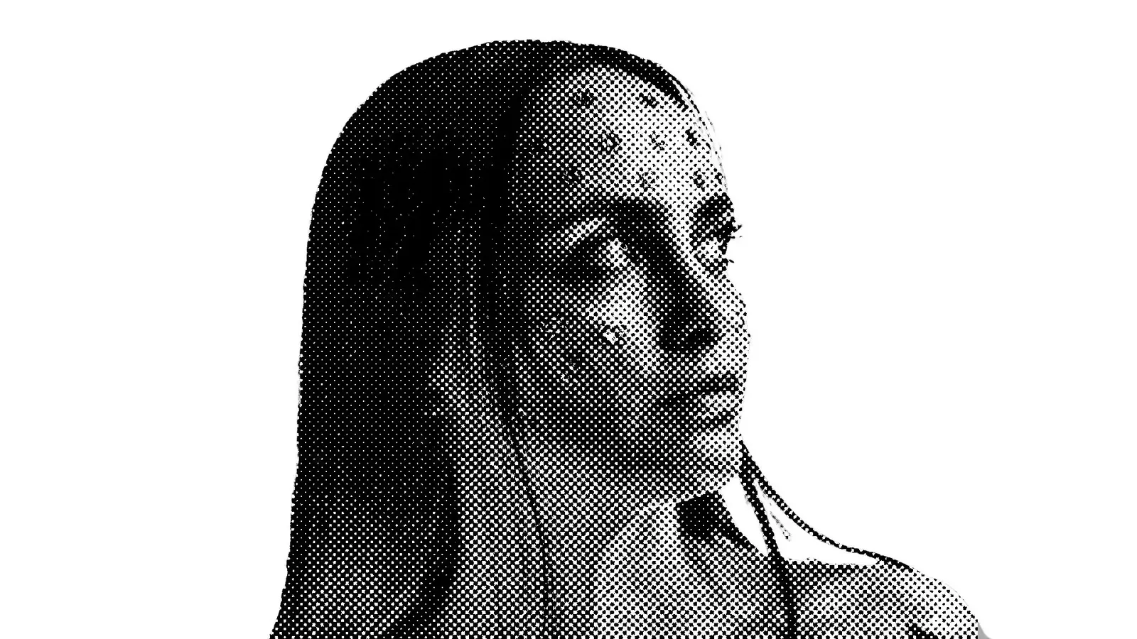 A black and white photo of a woman with long hair.